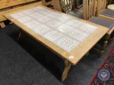 A Danish oak tiled top coffee table