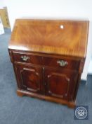 An inlaid mahogany bureau