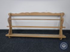 A pine wall mounted plate rack