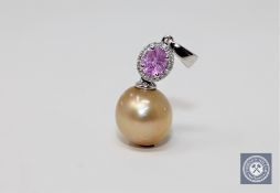 A pearl and pink sapphire pendant,