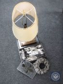 A tray of brass table lamp, stained glass panel, tray of cutlery,