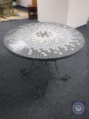 A metal mosaic tile top patio table