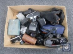 A box of cameras and accessories - Nikon F55 with lens, camera bags, two pairs of binoculars,