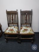 A pair of oak barley twist dining chairs