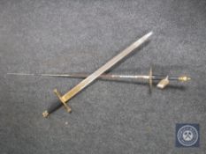 A Spanish sword together with a fencing foil