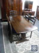 An Ercol refectory dining table and five oak ladder back chairs