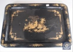 A Chinese lacquered papier mache tray