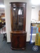 A mahogany corner display cabinet
