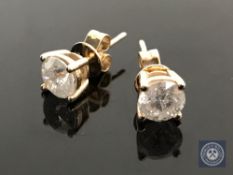 A pair of 14ct yellow gold diamond stud earrings, featuring two round brilliant cut diamonds 1.45ct.