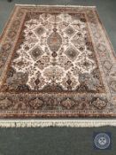 A machine made Indian style carpet, on pink ground,