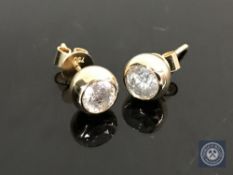 A pair of 14ct yellow gold diamond earrings featuring two round brilliant cut diamonds 1.0ct.