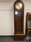 An early 20th century domed regulator clock with brass dial,