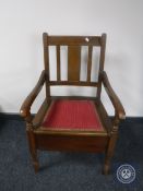 A 20th century oak commode chair