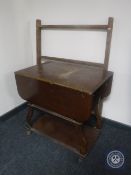 A folding pine towel rail and an oak tea trolley