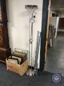 A chrome up-lighter and a projector screen