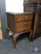 A walnut Queen Anne style bedside chest