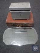 A frameless bevelled mirror together with a deed box and vintage leather luggage case