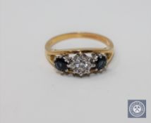 An 18ct gold sapphire and diamond three-stone ring,