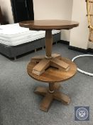 A pair of circular pedestal coffee tables