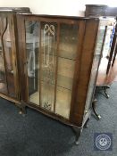 A walnut display cabinet