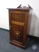 A Victorian inlaid mahogany pot cupboard