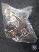 A bag containing a large quantity of costume jewellery