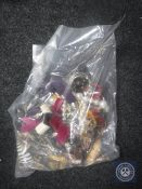 A bag containing a large quantity of costume jewellery