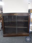 A set of Edwardian mahogany sliding door bookshelves with ormolu mounts