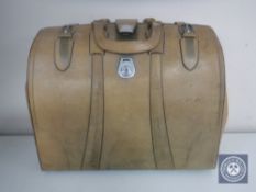 A vintage leather Gladstone bag