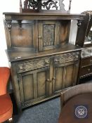 A carved oak court cupboard