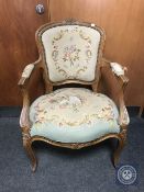 A carved walnut framed salon armchair