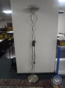 A contemporary chrome uplighter