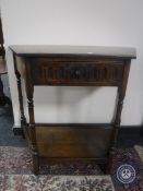 A shaped Jaycee Oak hall table fitted a drawer