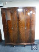 A mahogany Queen Anne style triple door wardrobe