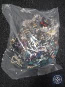 A bag containing a large quantity of costume jewellery