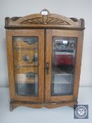 An Edwardian oak smoker's cabinet