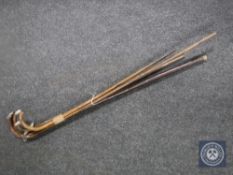 Four vintage walking sticks (three with silver handles).