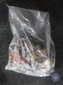 A bag containing a large quantity of costume jewellery