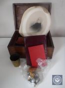 An antique wooden box containing British Railway buttons, eastern brass cup,
