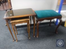 A mahogany dressing table and nest of three glass and leather topped tables