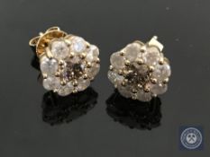 A pair of 18ct yellow gold diamond stud earrings featuring two round brilliant cut cognac diamonds