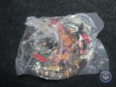 A bag containing a large quantity of costume jewellery