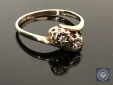 A 9ct gold diamond crossover ring, size N CONDITION REPORT: 1.