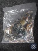 A bag containing a large quantity of costume jewellery