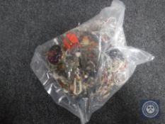 A bag containing a large quantity of costume jewellery