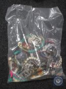 A bag containing a large quantity of costume jewellery