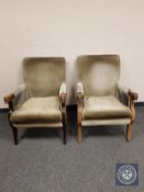 A pair of late Victorian oak armchairs with carved bull's head terminal arm rests, width 63 cm.