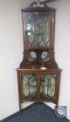 A Victorian inlaid mahogany double corner cabinet