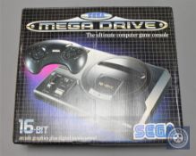 A Sega Mega Drive 16-Bit computer game console, boxed in retail condition.