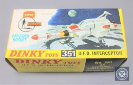 A Dinky Toys model 351 U.F.O Interceptor, with cap-fired rocket, boxed.